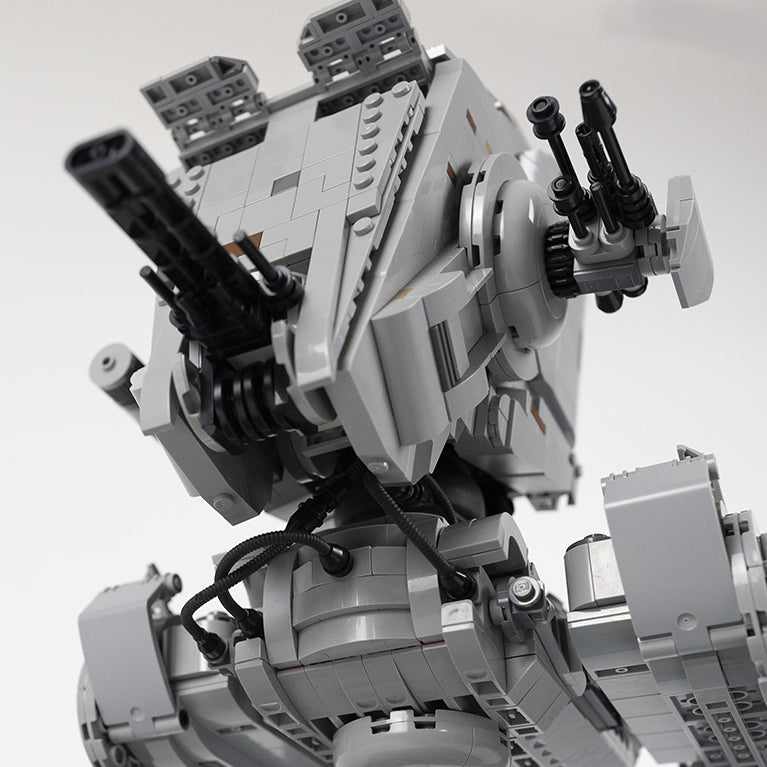 Close-up of a AT-ST with multiple gun turrets on a white background.
