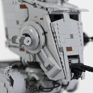 Close-up of a AT-ST of a spacecraft made from LEGO® bricks on a white background.