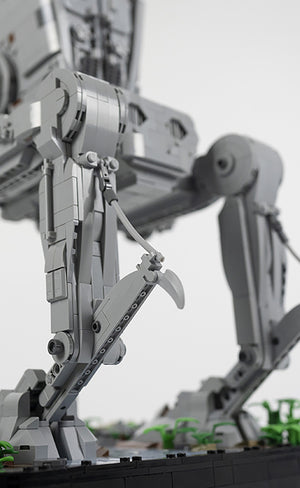 Close-up of a AT-ST legs and partial view of display base made from LEGO® bricks on a blurred background
