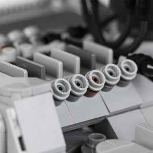 Close-up of a AT-ST model with engine details and blurred out hoses. 
