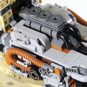 Close-up of a Kintan Strider Speeder bike engine with hood open showing exhaust ports and other ribbed hoses built with LEGO® bricks. 