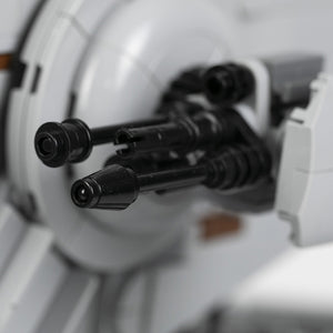 Close-up of AT-ST black cannons on a blurred background.