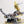 Side profile of the Kintan Strider Speeder bike engine with hood open showing exhaust ports and other ribbed hoses built with LEGO® bricks. 