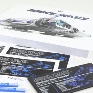 Brick Wars limited edition print manuals with model and branding on a white background.