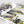 Opened manual of the Kintan Strider Speeder bike flipped to a gallery of images showcasing the Kintan Strider Speeder Bike from various angles. 