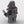 Rear view of MOC-Hunter from the Bad Batch buildable figures series facing left showing his backpacks and holding knives build with LEGO® bricks. 